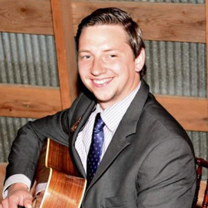 a person in a suit smiling