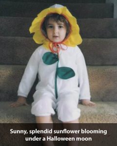 a baby wearing a yellow hat